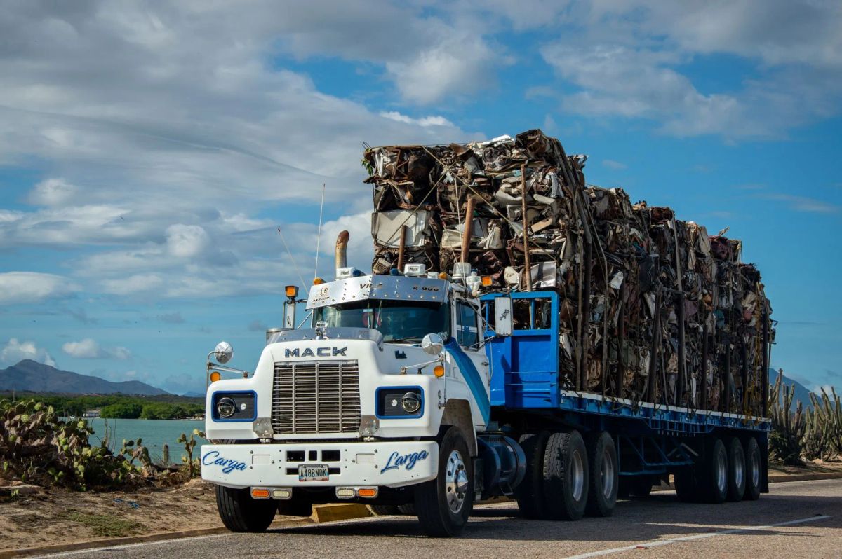 Jurado Junk Removal and Demolition crew loading household junk into a hauling truck in San Antonio